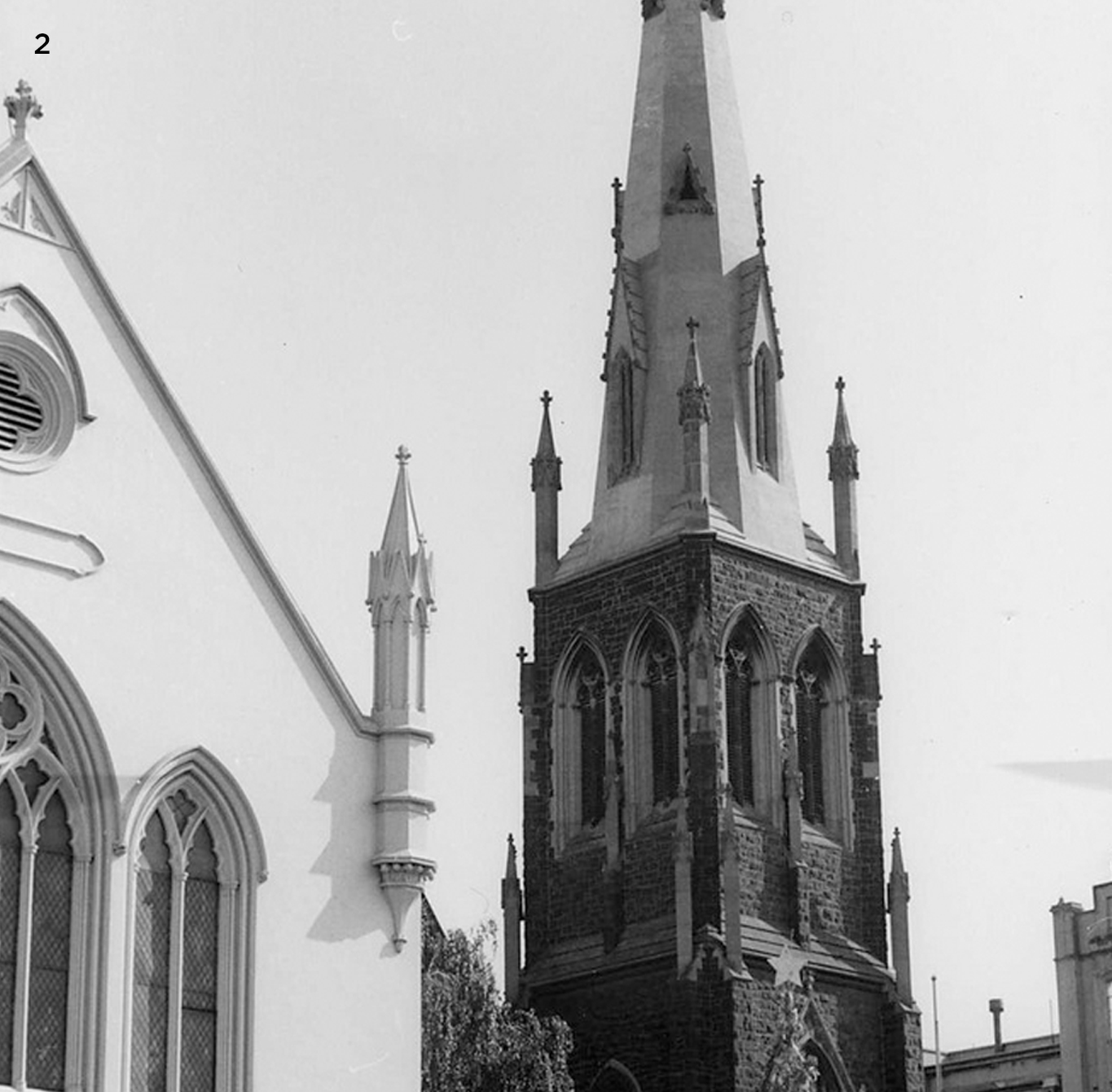 Part of the façade of the Conference Hall, with the church spire visible behind, 1963.